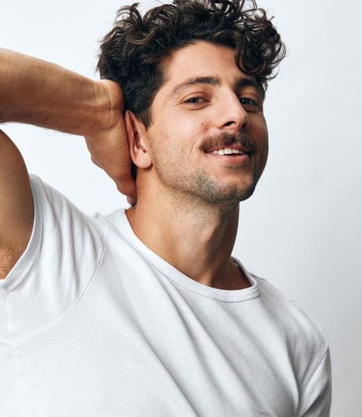 Isolated man background smile fashion t-shirt white portrait Lifestyle man t-shirt modern casual white standing smile background happy person adult portrait one fashion emotion cool attire happiness isolated closeup serious hipster idea model